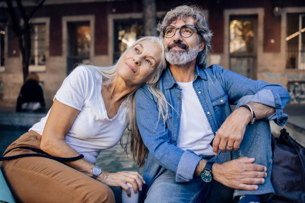 istock Mature couple on vacation taking a break while sightseeing 1402962878