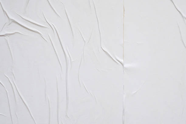 istock white crumpled and creased paper poster texture background 1402962966
