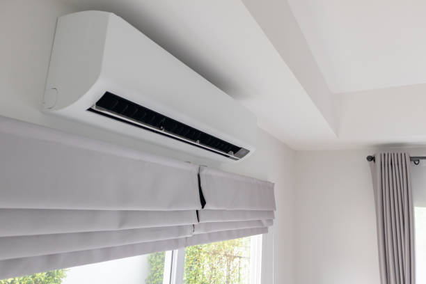 istock Air conditioner on white wall room interior background 1402962976