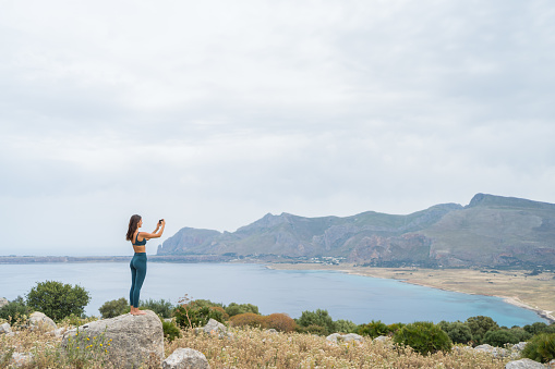 She takes photos of distant Mediterranean Sea on cellphone