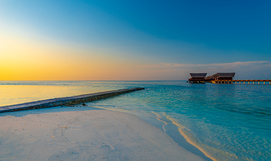 Maldives paradise island holiday resort at sunset