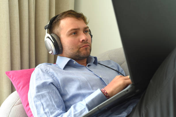 Happy woman with headphone and laptop posing