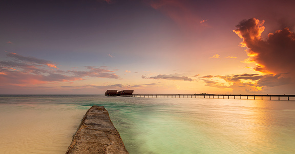 Maldives paradise island holiday resort at sunset