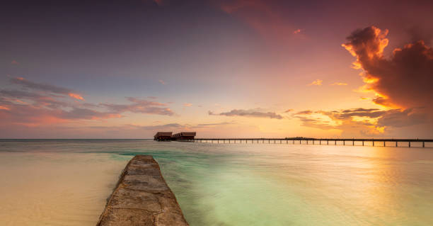Sunset on Maldives paradise island holiday resort stock photo