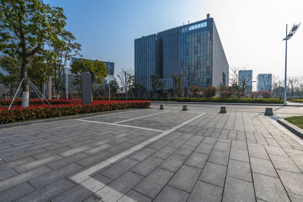 istock empty pavement and modern buildings in city 1402974993
