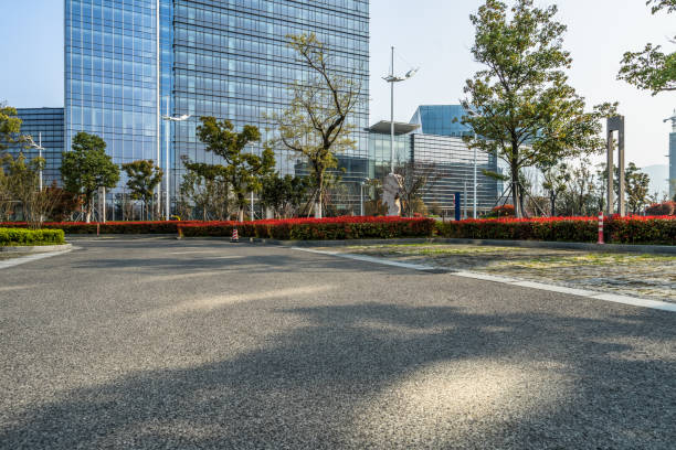 istock empty asphalt road near glass office building 1402975003