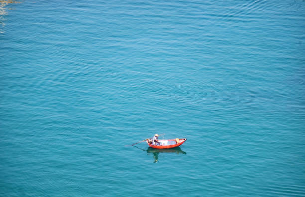 istock Fishing boat on the blue sea 1402976861