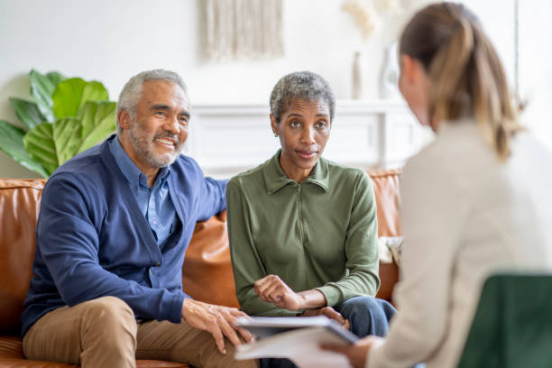 istock Senior Couple with a Financial Planner 1402977104