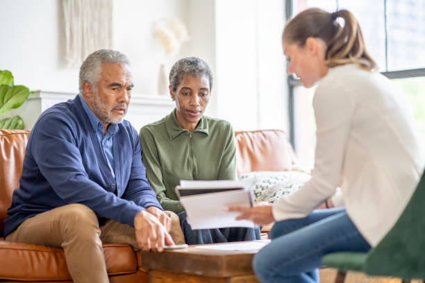 istock Senior Couple with a Financial Planner 1402977107