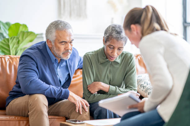 istock Senior Couple with a Financial Planner 1402977108