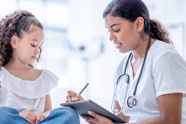 istock Little Girl at a Doctors Appointment 1402980604
