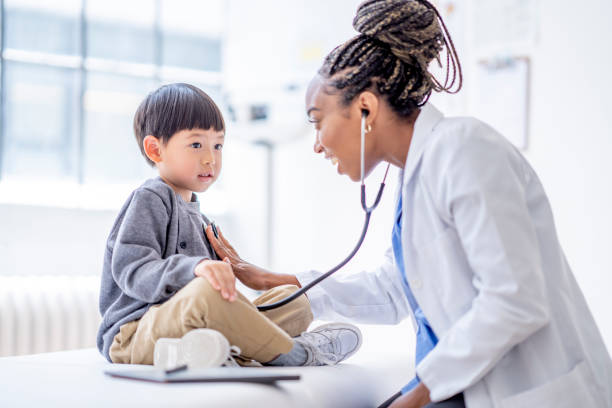 istock Listening to a Little Boys Heart 1402980658
