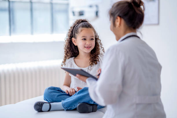 istock Little Girl at a Doctors Appointment 1402980670