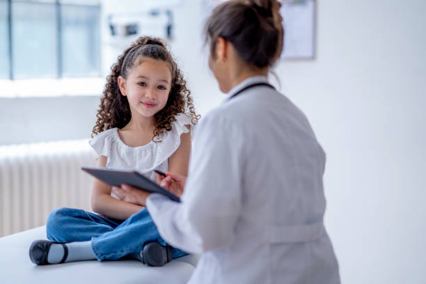 istock Little Girl at a Doctors Appointment 1402980685