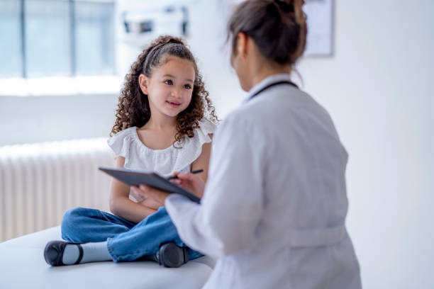 istock Little Girl at a Doctors Appointment 1402980687