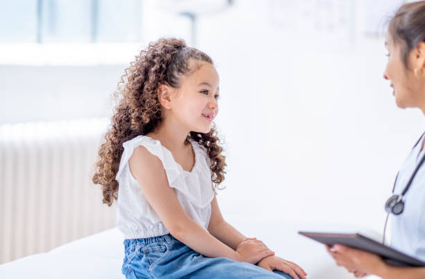 istock Little Girl at a Doctors Appointment 1402980691