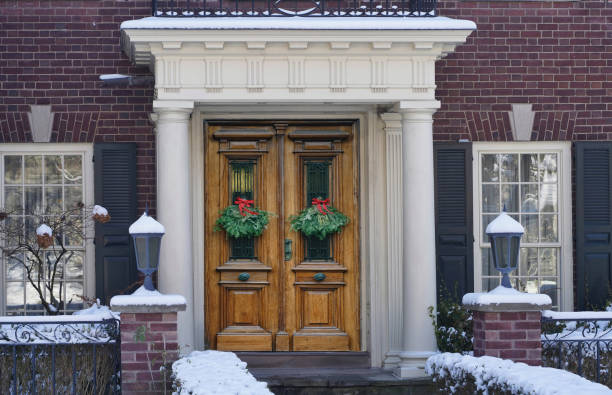 istock Christmas decoration on wood grain double front door 1402980742