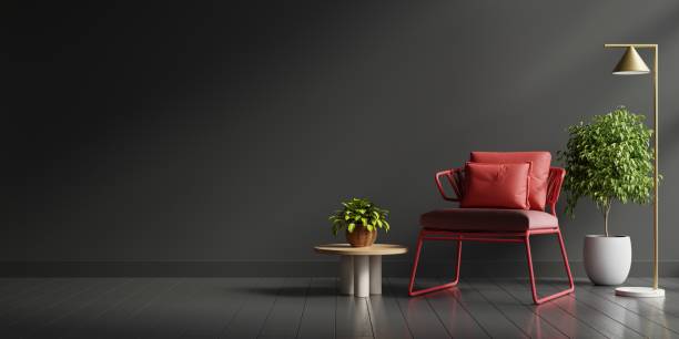 istock Interior design in dark tones with red armchair on black wall background. 1402983482