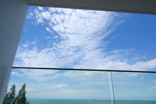 istock glass balcony with sea and sky background 1402983748