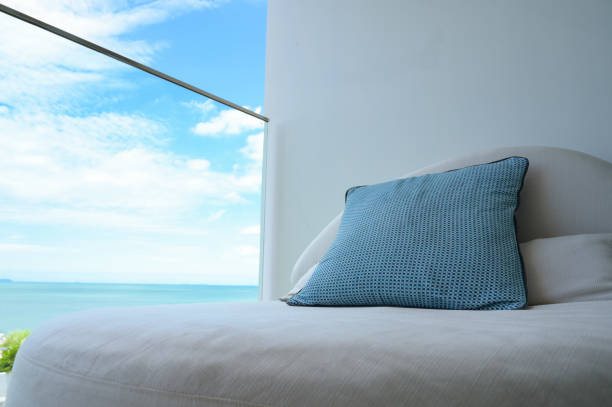 istock blue pillow on balcony with sky and sea 1402983763