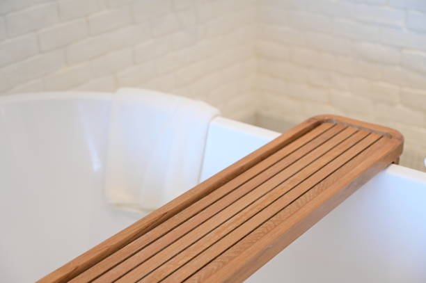 istock white towels put on bathtub in the bathroom 1402983938