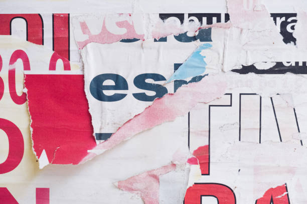 istock Torn street poster background, abstract weathered paper collage with random text 1402984893