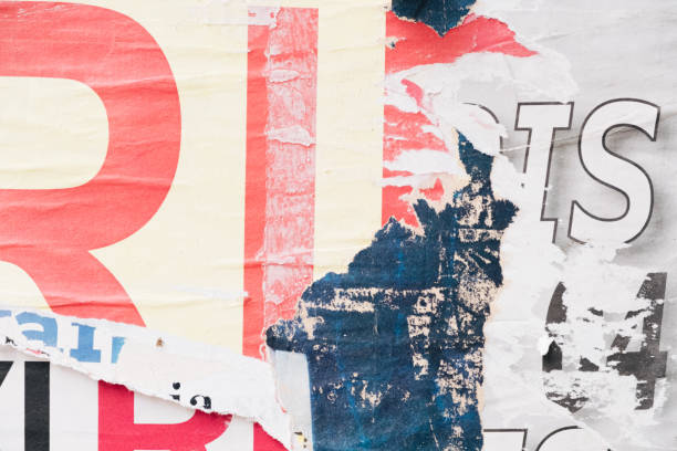 istock Torn street poster background, abstract weathered paper collage with random text 1402984916