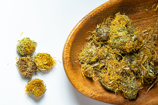 Cannabis leaf golden trophy isolated on orange background. 3d illustration