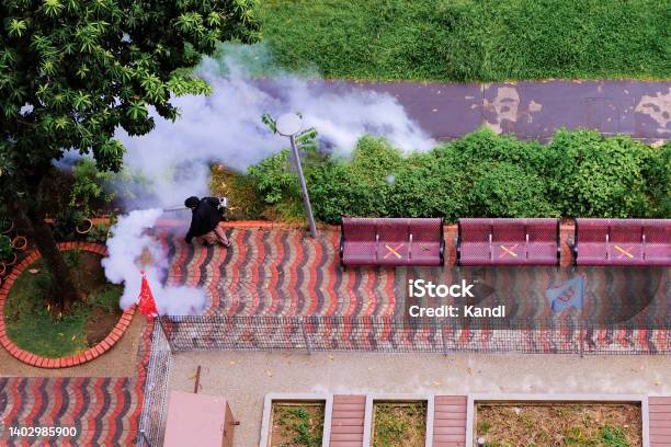 Mosquito Dengure Control In Neighbourhood Thermal Fogging Fumigation By Nea Singapore Stock Photo - Download Image Now