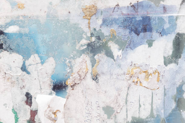 istock Torn and old street poster background, abstract paper collage texture 1402986125