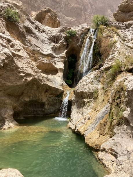 Wadis in Oman Hiking trip to the beautiful Wadi Shab and Wadi Mebam in Oman wadi shab stock pictures, royalty-free photos & images