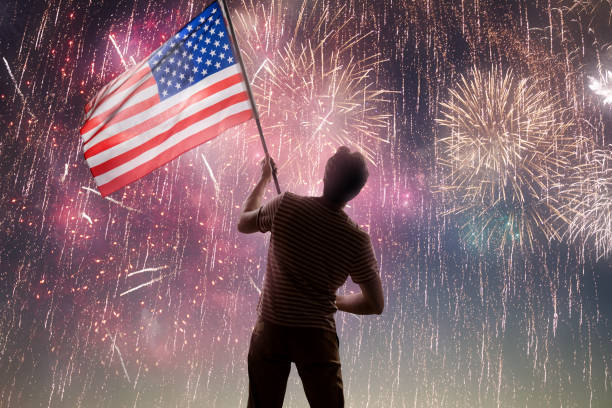 istock Patriotic holiday, man with American flag 1402987442