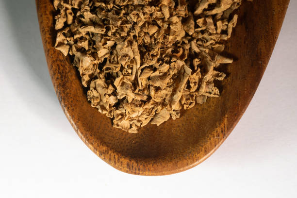 istock chinese medicine Ginger skin on white background 1402987584