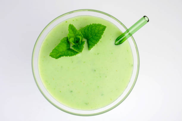 istock Fresh green mint smoothie isolated on white background. Flat lay. 1402989568