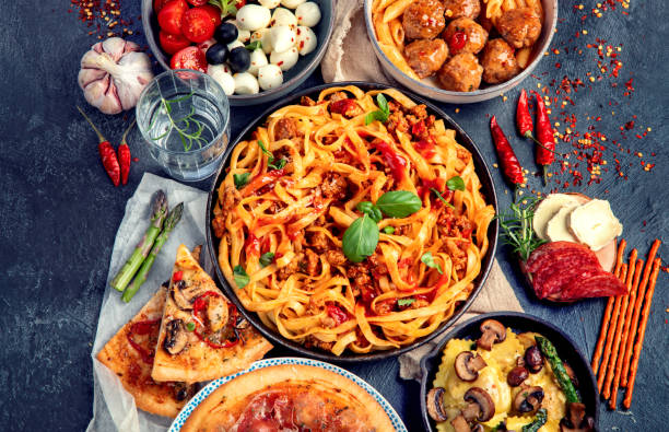 istock Italian food assortment on dark background. 1402989681
