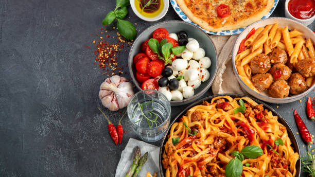 istock Italian food assortment on dark background. 1402989739