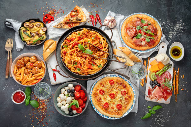 istock Italian food assortment on dark background. 1402990577