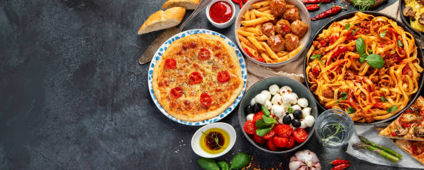 istock Italian food assortment on dark background. 1402990579