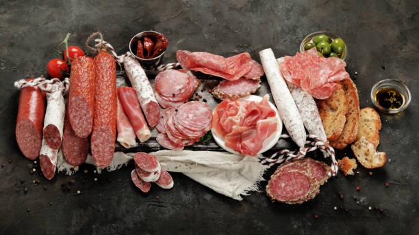 istock Sasusages assortment on dark background. 1402990619