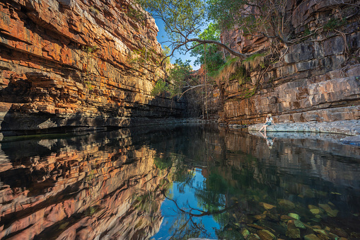 A lady is enjoying beautiful The Grotto in Wyndham, Kimberley, Western Australia