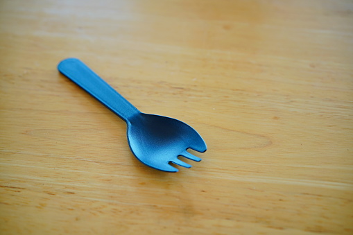 2 in 1 with plastic fork and spoon on table
