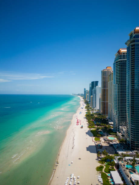 Vertical aerial photo oceanfront condos Sunny Isles Beach FL Vertical aerial photo oceanfront condos Sunny Isles Beach FL real estate outdoors vertical usa stock pictures, royalty-free photos & images