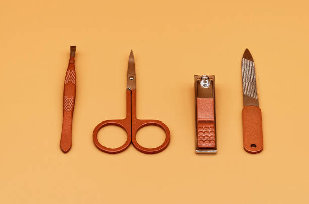 istock Set for cutting nails. Tools of a manicure set on a beige background 1402994807