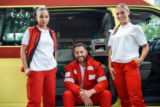 istock Happy, smiling doctors working team standing by the ambulance. 1402995946