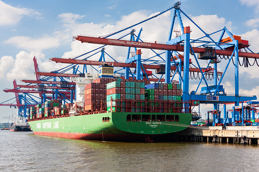 Top view of a large cargo ship loading or loading grain. Sea transportation.