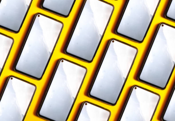 istock Mobile phone mockup photography on yellow background 1402998786