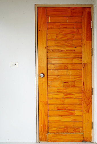 Wooden door on wall background