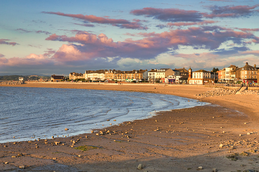 13 July 2019: Morecambe, Lancashire, UK - The beach at sunset, with a rising tide.