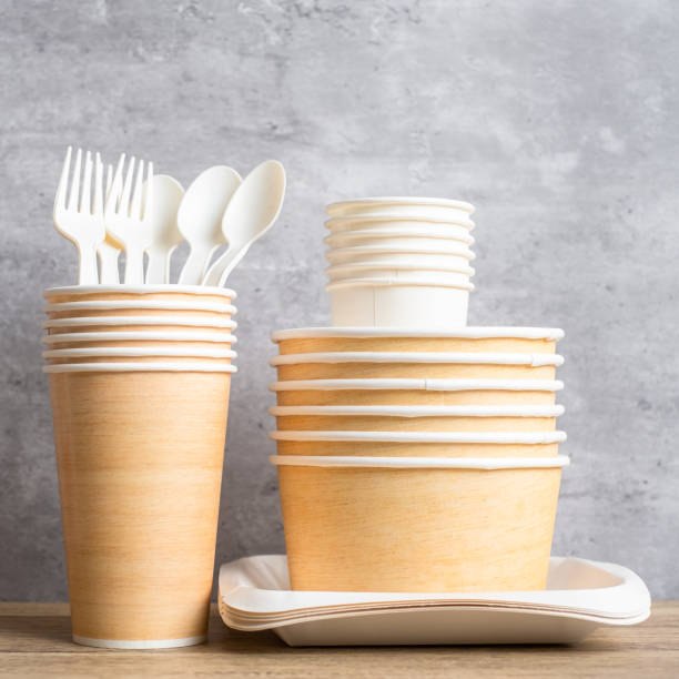 istock Eco friendly food packaging on table background. natural container: cup, plate, spoon and fork. zero waste, pollution, earth day, free plastic, world Environment day concept 1403003192