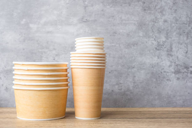 istock Eco friendly food packaging on table background. natural container: cup and bowl. zero waste, pollution, earth day, free plastic, world Environment day concept 1403003310
